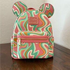 Bundle of Disney Parks Loungefly Pink and Green Swirl Backpack and matching ears